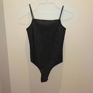 Black and white strip bodysuit by BCBG